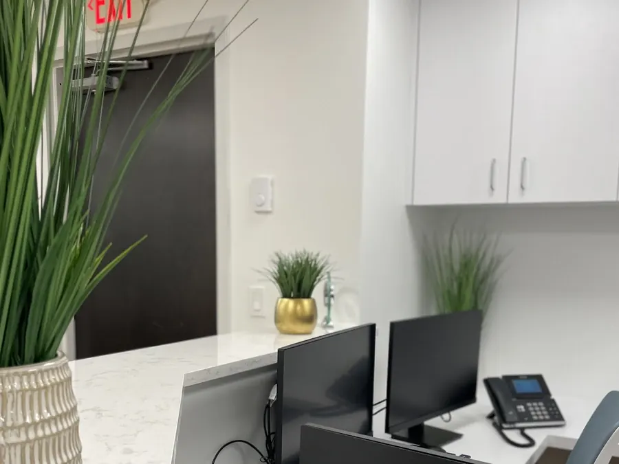 The front counter, with a potted grass, at the Seaview Boulevard office.