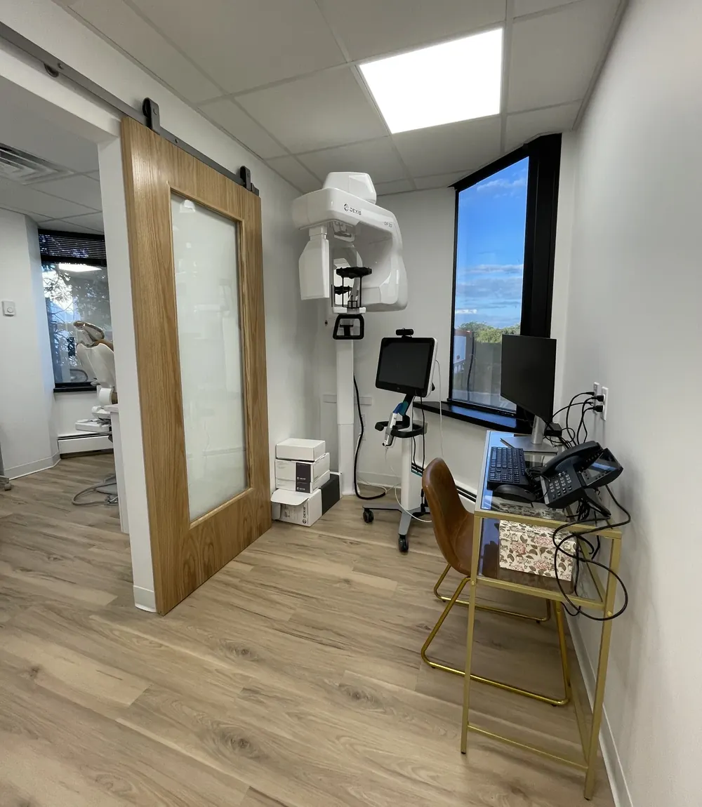 The x-ray room, with its imaging unit and a sliding barn door, at the Seaview Boulevard office.